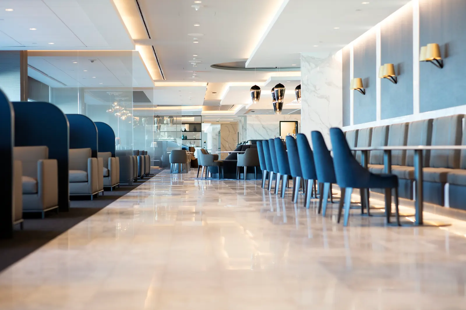 Second-floor overlook of seating below in the United Polaris Lounge at San Francisco (SFO).