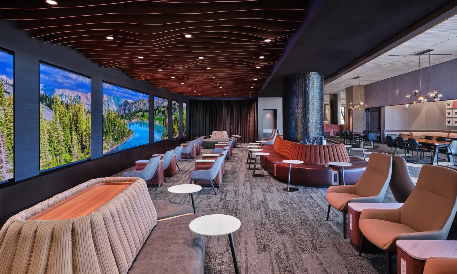A digital immersion wall inside the lounge displays panoramic visuals of Utah landmarks.