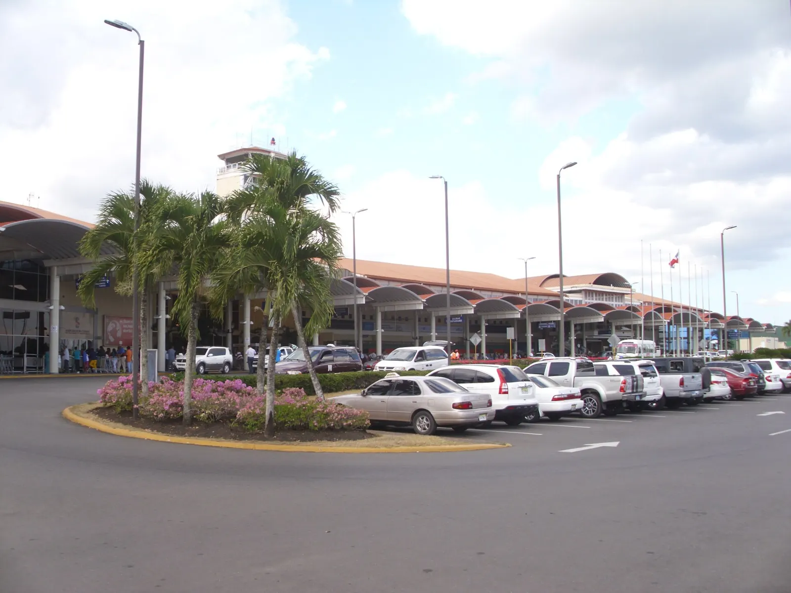 Cibao International Airport passenger terminal and the main parking apron in front of the hall.