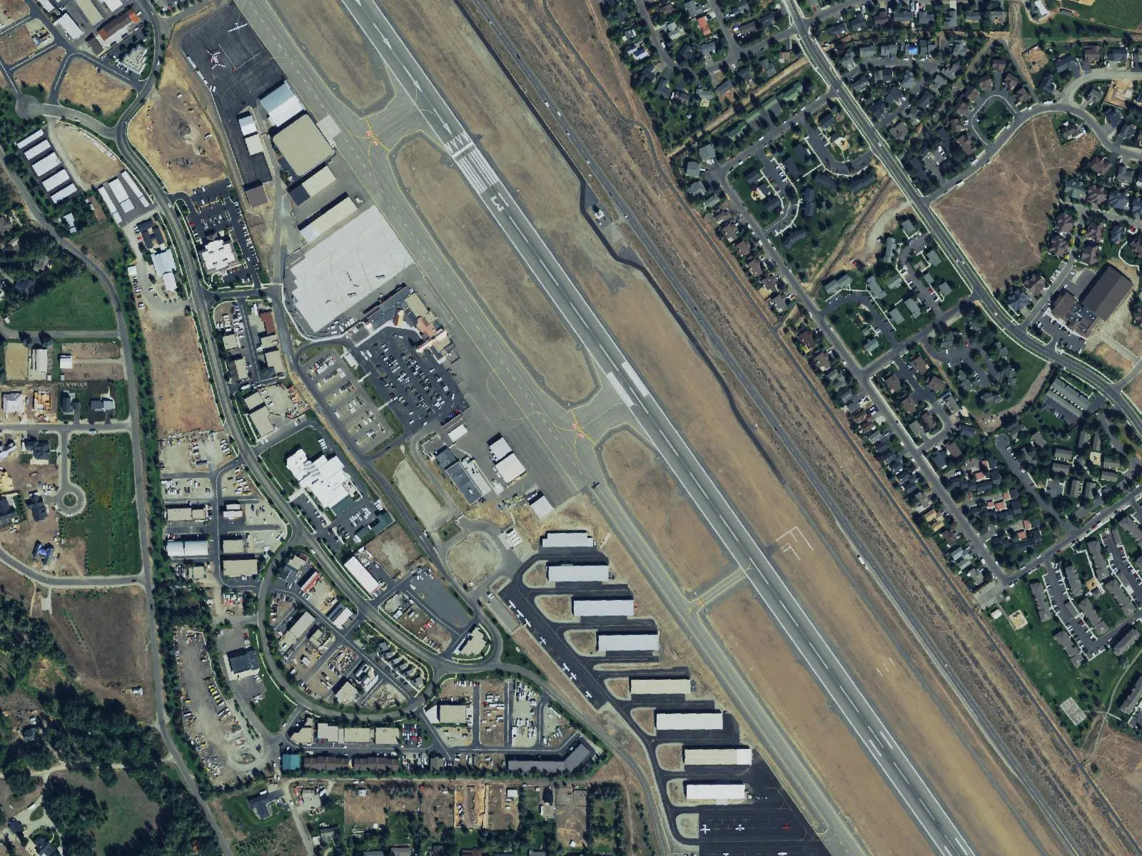 Closer USGS NAIP crop of the Friedman Memorial passenger terminal, commercial apron, and hangar rows on the west side of the runway in Hailey.