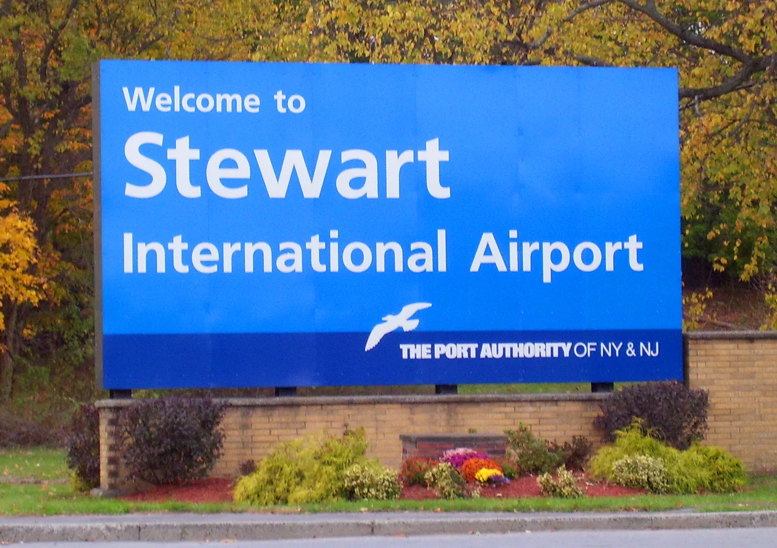 Roadside Port Authority sign for Stewart International Airport along New York 207 in New Windsor.