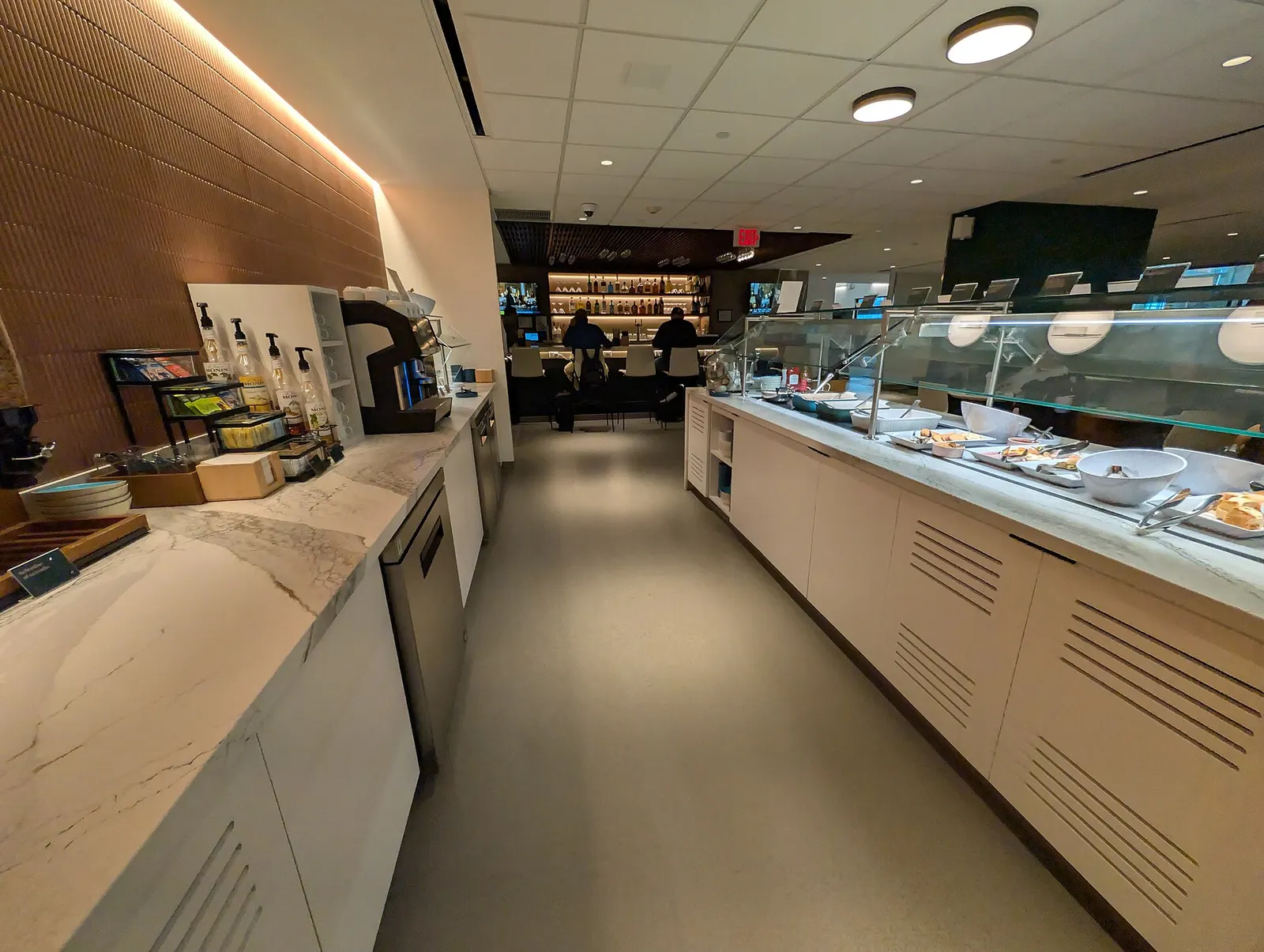 The drinks on the left side, the buffet on the right side and the bar at the back. Escape Lounge just inside security at Tulsa International Airport. 7777 Airport Drive, Tulsa, Oklahoma 74115.
