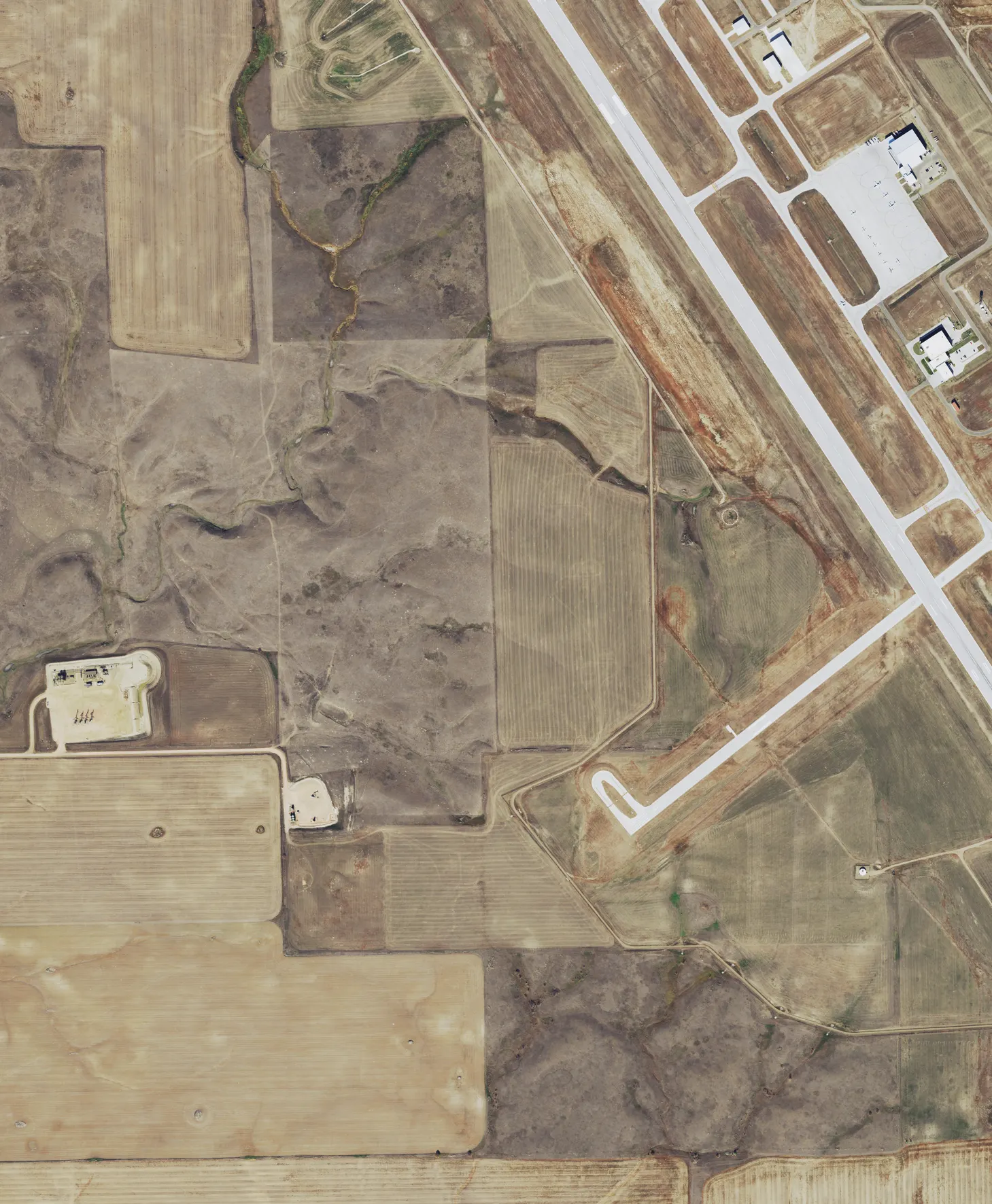 Cropped September 2021 NAIP aerial of the southwest runway end at Williston Basin International Airport (XWA).