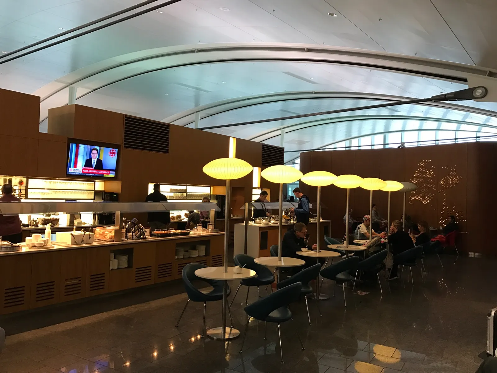 A traveler relaxes inside Air Canada's Maple Leaf Lounge International before a flight to Frankfurt.