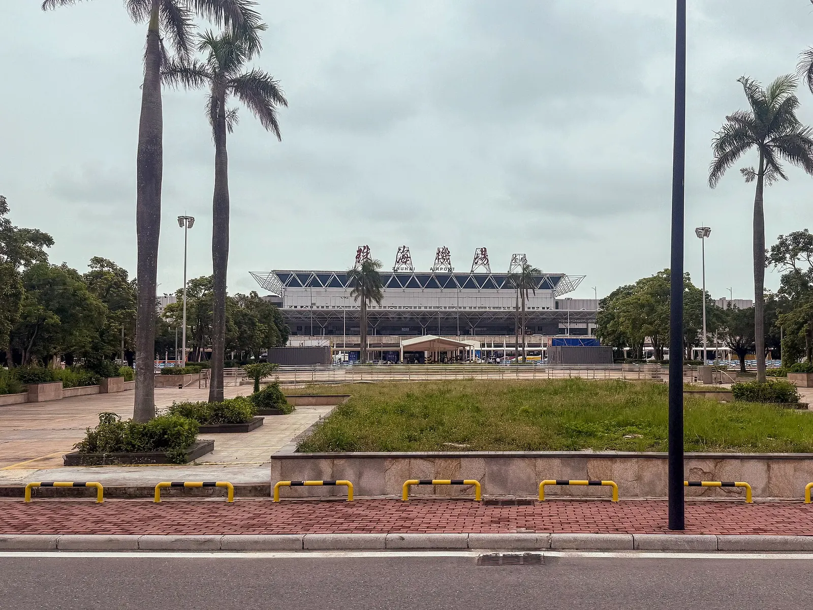 Zhuhai Jinwan Airport landside approach and Terminal 1 facade on 10 May 2026.